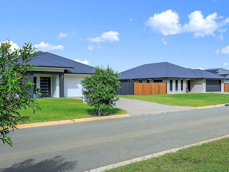 Row of well kept homes on masterplanned street in estate