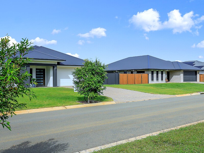 Row of well kept homes on masterplanned street in estate